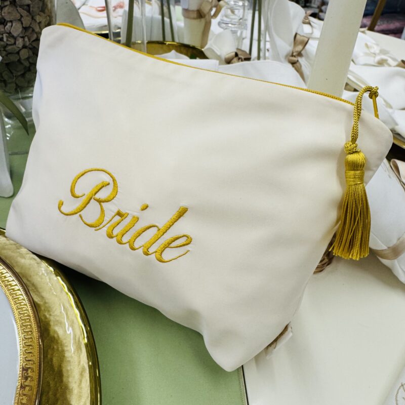 Pochette Bride ricamata con nappina dorata